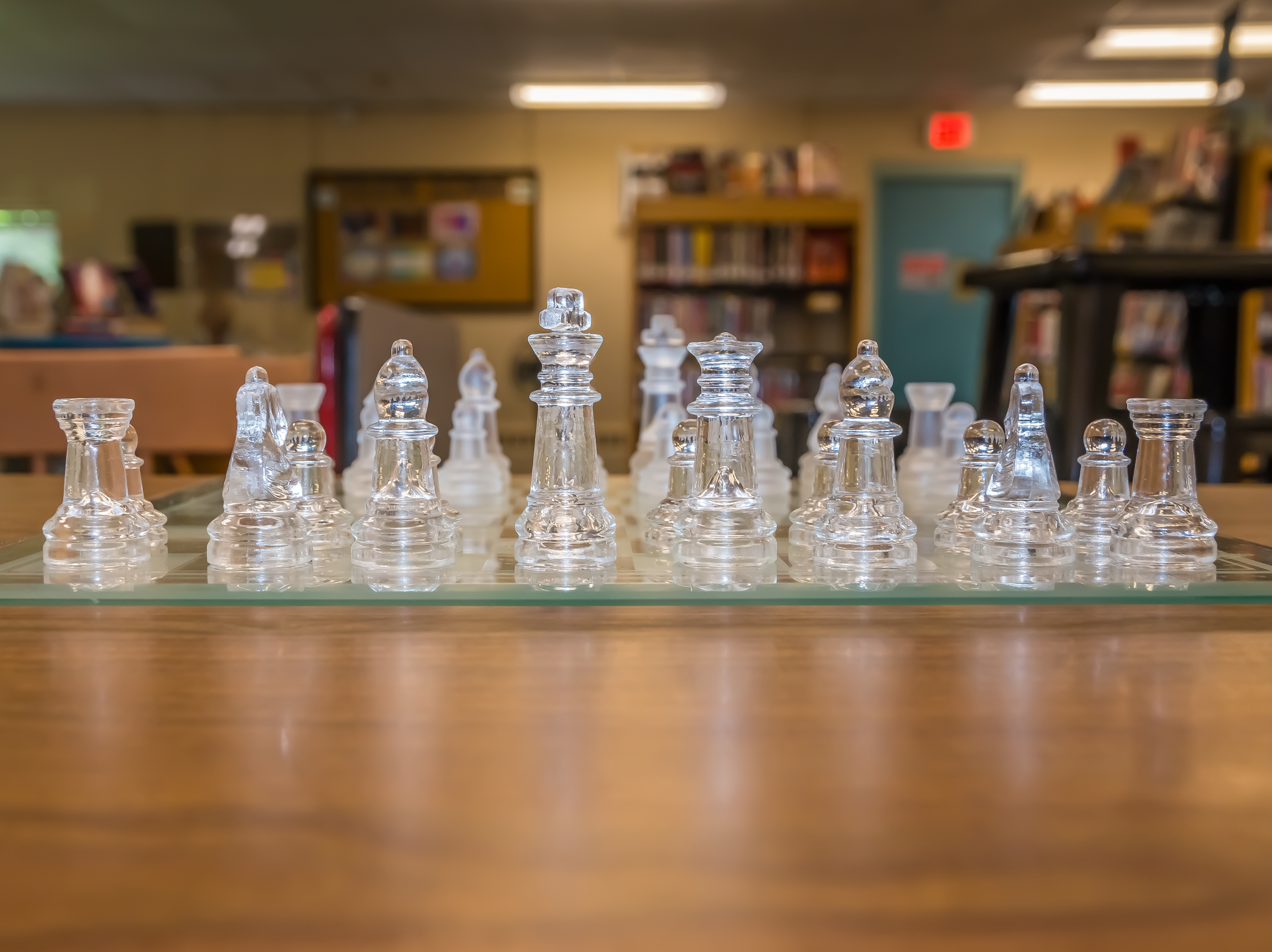 chess game with teen area in background