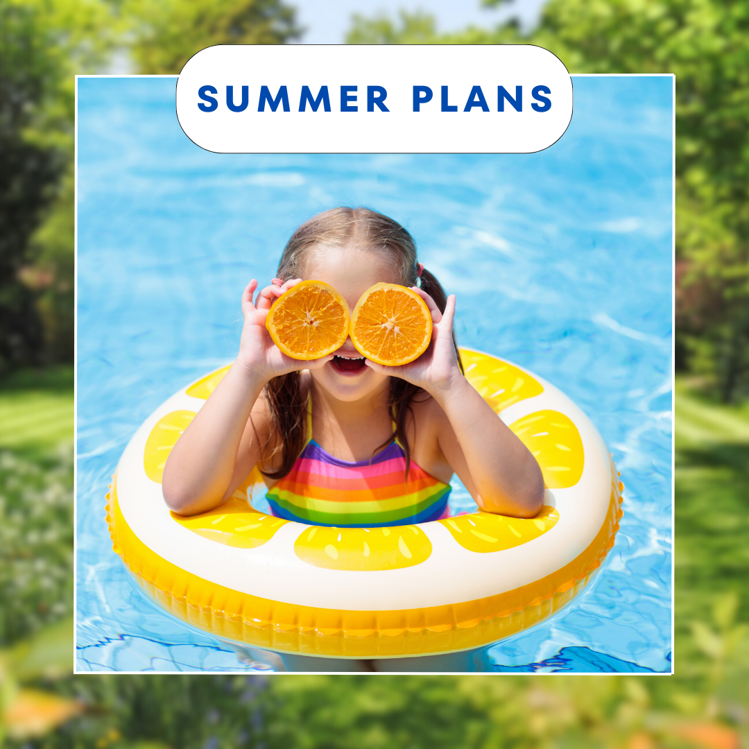 Girl in floaty in a pool with oranges over her eyes.