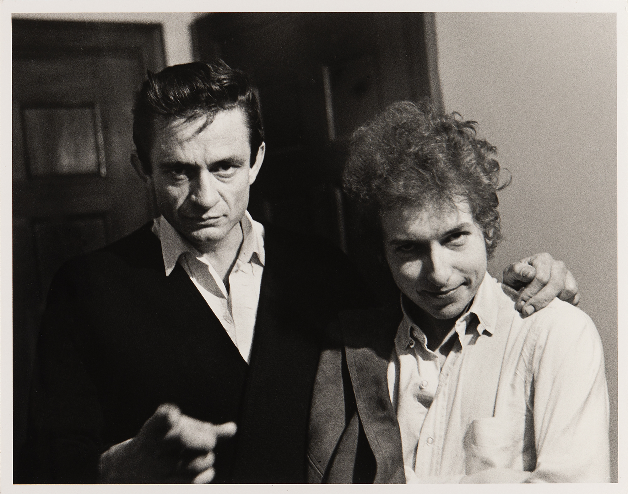black & white photo of Johnny Cash & Bob Dylan