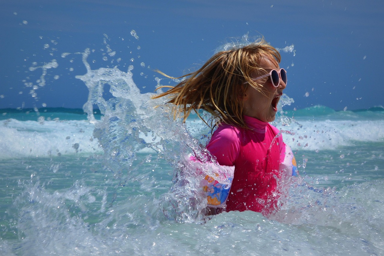Child splashing in the ocean