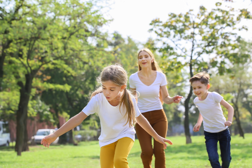 three kids playing outside