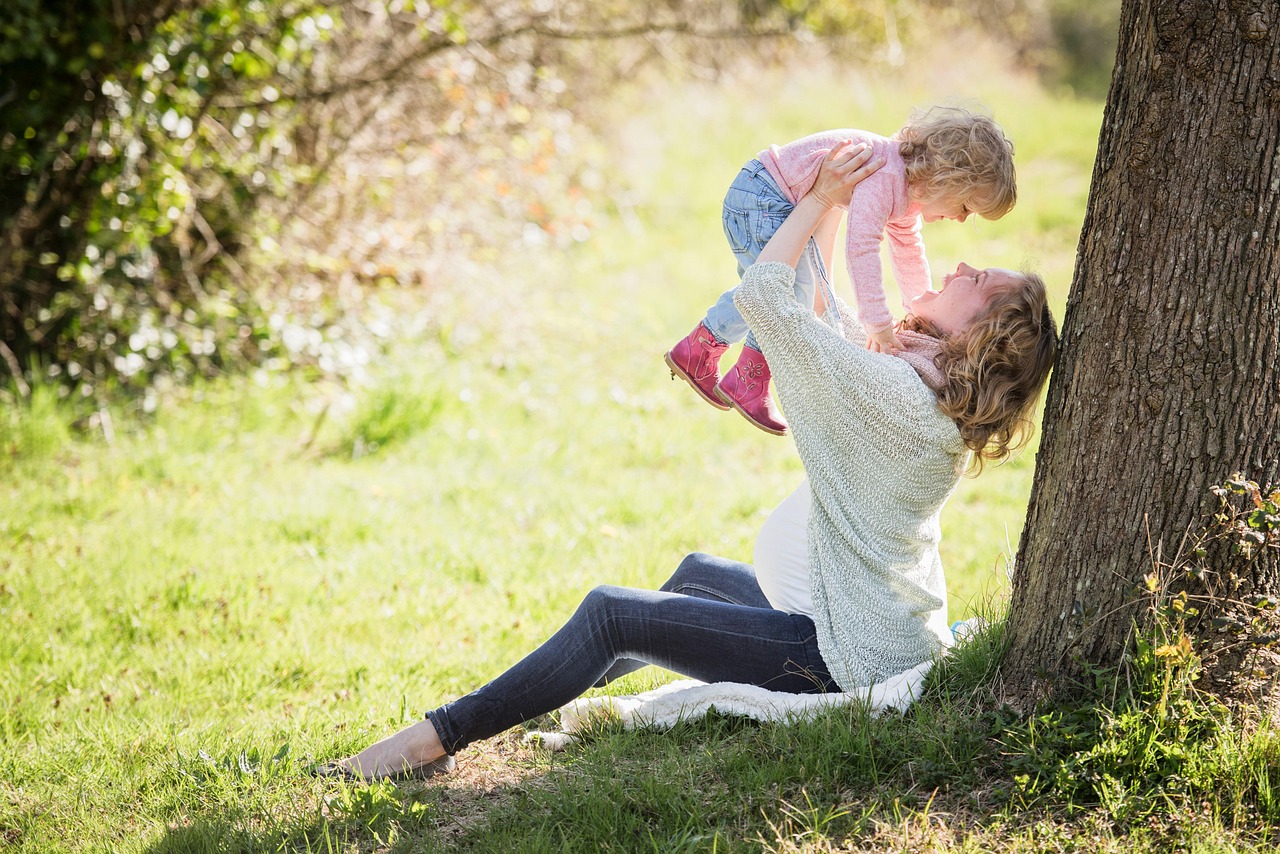 Mom and Baby against a tree