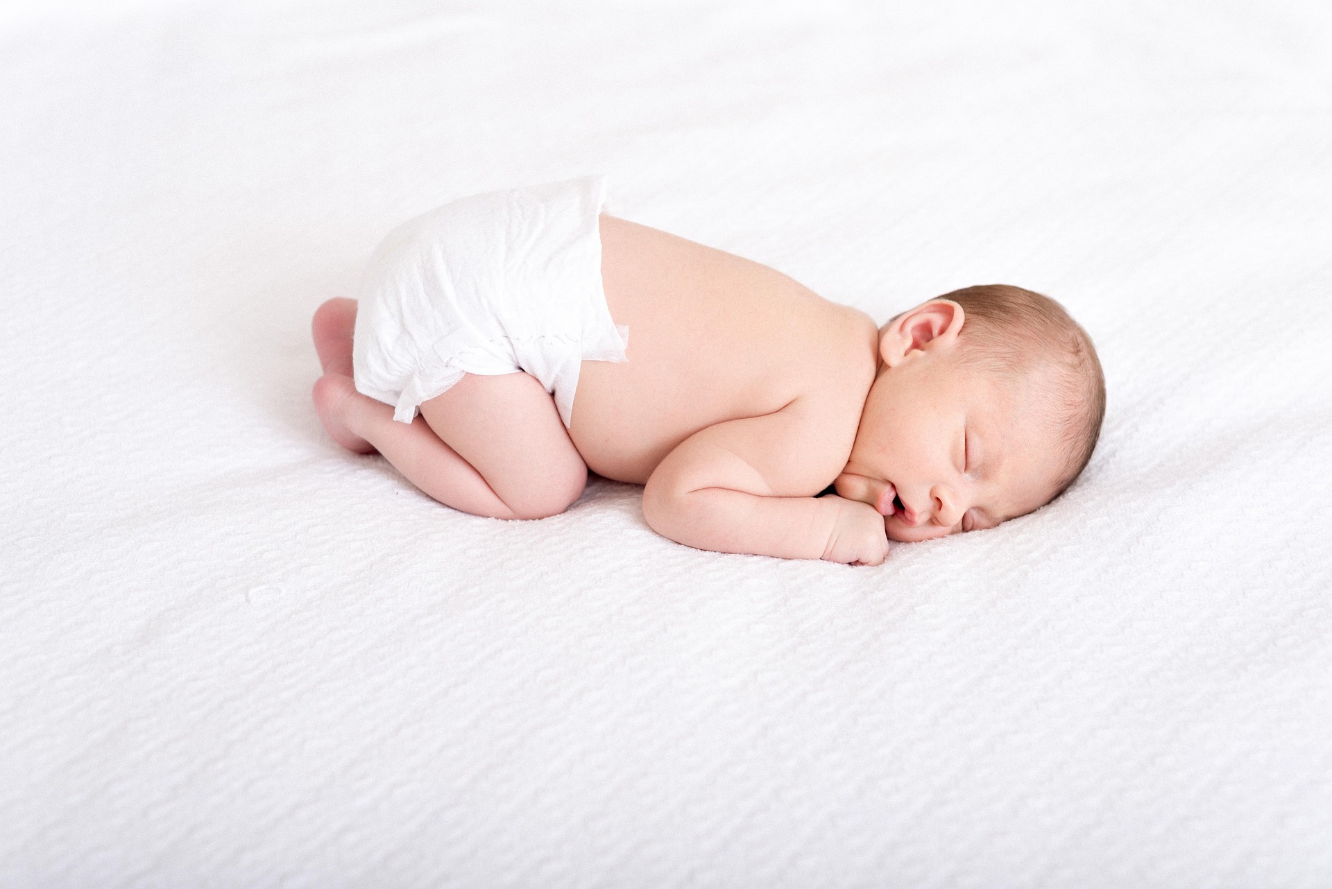 sleeping baby in a diaper