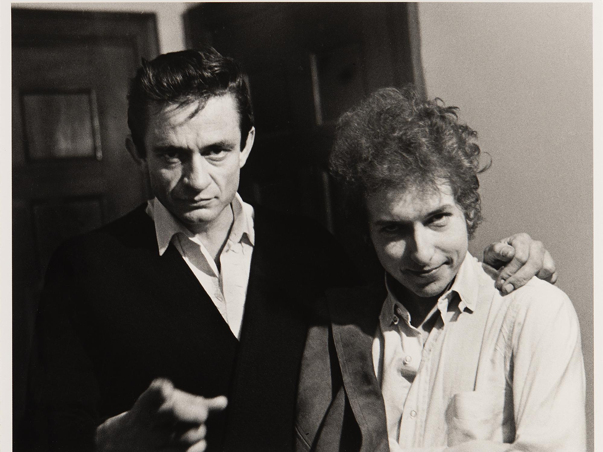 black & white photo of Johnny Cash & Bob Dylan