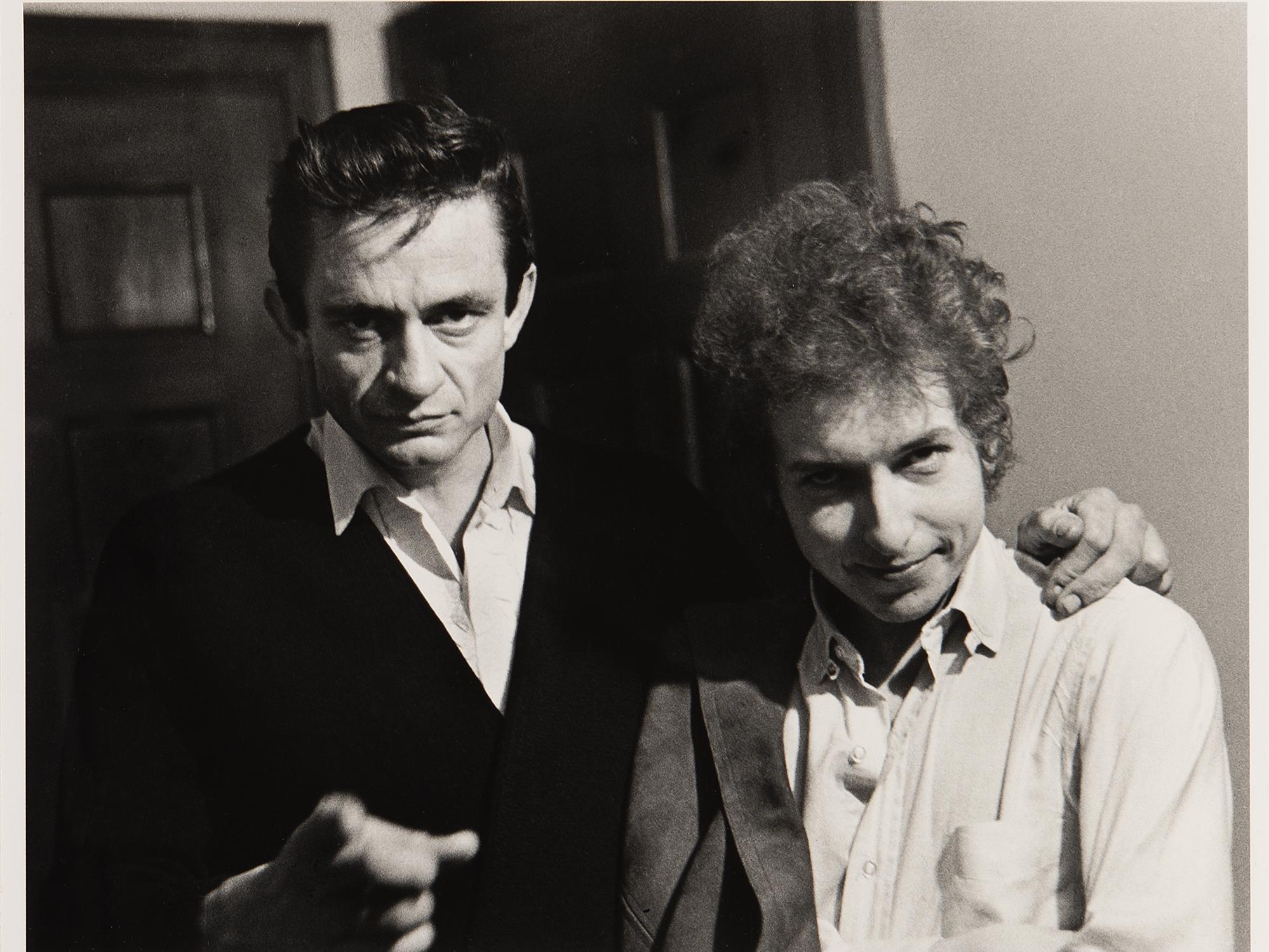 black & white photo of Johnny Cash & Bob Dylan