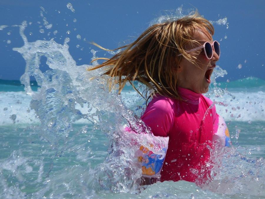 Child splashing in the ocean
