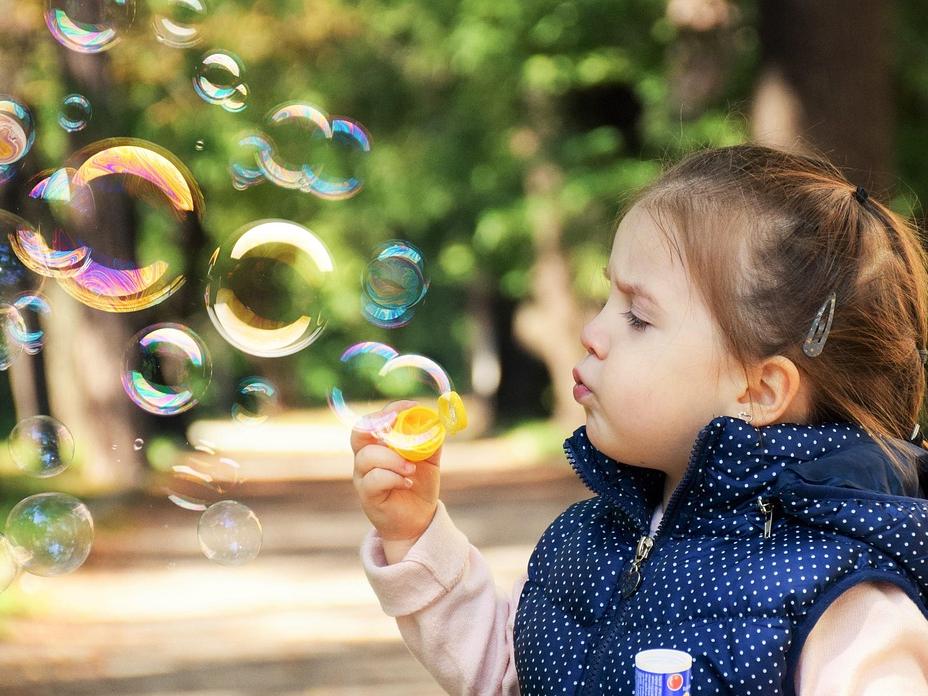 Child blowing bubbles