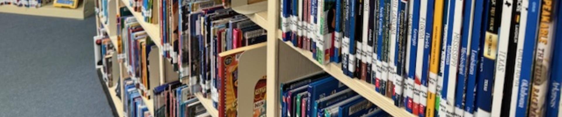 Nonfiction shelves with books